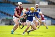 25 March 2023; Ian Shanahan of Laois in action against Eoin Keyes of Westmeath during the Allianz Hurling League Division 1 Relegation Play-Off match between Westmeath and Laois at FBD Semple Stadium in Thurles, Tipperary. Photo by Michael P Ryan/Sportsfile