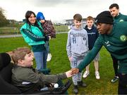 25 March 2023; Michael Obafemi meets Vincent Lyons, age 12, from Blanchardstown, and his family after a Republic of Ireland training session at the FAI National Training Centre in Abbotstown, Dublin. Photo by Stephen McCarthy/Sportsfile