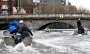25 March 2023; The UCD team, from front to back, Shauna Fitzsimons (Cox), Fintan Earley, Sam Daly, David Somers, Paul Flood, Luke Dunleavy, Mika Ryan, Mikey Campion and David Crooks on their way to winning the Colours Boat Race between UCD and Trinity College on the River Liffey in Dublin. Photo by David Fitzgerald/Sportsfile