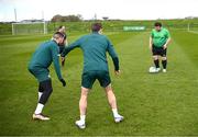 25 March 2023; Omer Teko of the Special Olympics Ireland Football Team trains with Matt Doherty and Seamus Coleman, right, during a visit to a Republic of Ireland training session, held at the FAI National Training Centre in Abbotstown, Dublin, ahead of the Special Olympics World Games being held in Berlin, From 17 to 25 June 2023. Photo by Stephen McCarthy/Sportsfile