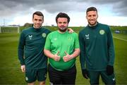 25 March 2023; Omer Teko of the Special Olympics Ireland Football Team with Seamus Coleman, left, and Matt Doherty, right, during a visit to a Republic of Ireland training session, held at the FAI National Training Centre in Abbotstown, Dublin, ahead of the Special Olympics World Games being held in Berlin, From 17 to 25 June 2023. Photo by Stephen McCarthy/Sportsfile
