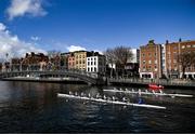 25 March 2023; The UCD team, left, competing against Trinity during the Novice Boys Colours Boat Race between UCD and Trinity College on the River Liffey in Dublin. Photo by David Fitzgerald/Sportsfile