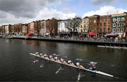 25 March 2023; The UCD team, left, compete against Trinity during the Novice Girls Colours Boat Race between UCD and Trinity College on the River Liffey in Dublin. Photo by David Fitzgerald/Sportsfile