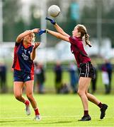 25 March 2023; Ava McAuliffe of St Mary's High School gets a pass away despite the attention of Ailbhe Kennedy of Loreto College during the Lidl LGFA Post Primary Junior A Final match between Loreto College Cavan and St Mary's High School Midleton, Cork at the GAA National Games Development Centre in Abbotstown, Dublin. Photo by Ben McShane/Sportsfile