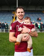 25 March 2023; Robbie Greville of Westmeath with his daughter Aida, age 3 and a half months, after the Allianz Hurling League Division 1 Relegation Play-Off match between Westmeath and Laois at FBD Semple Stadium in Thurles, Tipperary. Photo by Michael P Ryan/Sportsfile