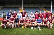 25 March 2023; Westmeath players including Robbie Greville, centre, with his daughter Aida, age 3 and half months, after the Allianz Hurling League Division 1 Relegation Play-Off match between Westmeath and Laois at FBD Semple Stadium in Thurles, Tipperary. Photo by Michael P Ryan/Sportsfile