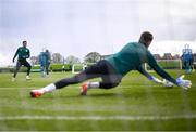 25 March 2023; Goalkeeper Mark Travers saves from Chiedozie Ogbene during a Republic of Ireland training session at the FAI National Training Centre in Abbotstown, Dublin. Photo by Stephen McCarthy/Sportsfile