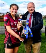 25 March 2023; Loreto College captain Sarah Clarke is presented the cup by Pat Quill, representing the LGFA, after the Lidl LGFA Post Primary Junior A Final match between Loreto College Cavan and St Mary's High School Midleton, Cork at the GAA National Games Development Centre in Abbotstown, Dublin. Photo by Ben McShane/Sportsfile