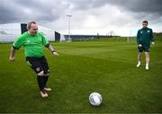 25 March 2023; Henry Cloran of the Special Olympics Ireland Football Team with Seamus Coleman during a visit to a Republic of Ireland training session, held at the FAI National Training Centre in Abbotstown, Dublin, ahead of the Special Olympics World Games being held in Berlin, From 17 to 25 June 2023. Photo by Stephen McCarthy/Sportsfile