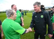 25 March 2023; Raymond Singleton, left, of the Special Olympics Ireland Football Team with manager Stephen Kenny during a visit to a Republic of Ireland training session, held at the FAI National Training Centre in Abbotstown, Dublin, ahead of the Special Olympics World Games being held in Berlin, From 17 to 25 June 2023. Photo by Stephen McCarthy/Sportsfile