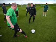 25 March 2023; Stephen O'Leary of the Special Olympics Ireland Football Team with manager Stephen Kenny during a visit to a Republic of Ireland training session, held at the FAI National Training Centre in Abbotstown, Dublin, ahead of the Special Olympics World Games being held in Berlin, From 17 to 25 June 2023. Photo by Stephen McCarthy/Sportsfile