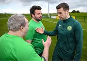 25 March 2023; Henry Cloran, left, and Omer Teko of the Special Olympics Ireland Football Team meets Seamus Coleman during a visit to a Republic of Ireland training session, held at the FAI National Training Centre in Abbotstown, Dublin, ahead of the Special Olympics World Games being held in Berlin, From 17 to 25 June 2023. Photo by Stephen McCarthy/Sportsfile