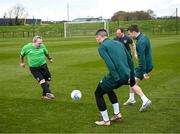 25 March 2023; Henry Cloran of the Special Olympics Ireland Football Team trains with Matt Doherty and Seamus Coleman, right, during a visit to a Republic of Ireland training session, held at the FAI National Training Centre in Abbotstown, Dublin, ahead of the Special Olympics World Games being held in Berlin, From 17 to 25 June 2023. Photo by Stephen McCarthy/Sportsfile