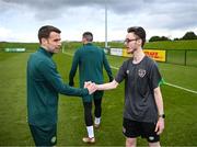 25 March 2023; Raymond Singleton of the Special Olympics Ireland Football Team meets Seamus Coleman during a visit to a Republic of Ireland training session, held at the FAI National Training Centre in Abbotstown, Dublin, ahead of the Special Olympics World Games being held in Berlin, From 17 to 25 June 2023. Photo by Stephen McCarthy/Sportsfile