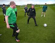 25 March 2023; Stephen O'Leary of the Special Olympics Ireland Football Team with manager Stephen Kenny during a visit to a Republic of Ireland training session, held at the FAI National Training Centre in Abbotstown, Dublin, ahead of the Special Olympics World Games being held in Berlin, From 17 to 25 June 2023. Photo by Stephen McCarthy/Sportsfile