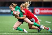 25 March 2023; Molly Scuffil-McCabe of Ireland is tackled by Courtney Keight of Wales during the TikTok Women's Six Nations Rugby Championship match between Wales and Ireland at Cardiff Arms Park in Cardiff, Wales. Photo by Mark Lewis/Sportsfile
