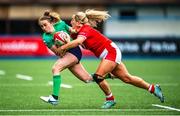 25 March 2023; Molly Scuffil-McCabe of Ireland is tackled by Courtney Keight of Wales during the TikTok Women's Six Nations Rugby Championship match between Wales and Ireland at Cardiff Arms Park in Cardiff, Wales. Photo by Mark Lewis/Sportsfile