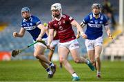 25 March 2023; Eoin Keyes of Westmeath in action against Laois Players Stephen Maher, left, and Aaron Dunphy during the Allianz Hurling League Division 1 Relegation Play-Off match between Westmeath and Laois at FBD Semple Stadium in Thurles, Tipperary. Photo by Michael P Ryan/Sportsfile