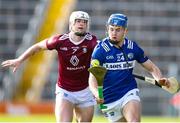 25 March 2023; Tomás Keyes of Laois in action against Jack Galvin of Westmeath during the Allianz Hurling League Division 1 Relegation Play-Off match between Westmeath and Laois at FBD Semple Stadium in Thurles, Tipperary. Photo by Michael P Ryan/Sportsfile