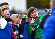 25 March 2023; Goal scorer Kevin Zefi of Republic of Ireland takes a selfi with supporters after his side's victory in the UEFA European Under-19 Championship Elite Round match between Republic of Ireland and Estonia at Ferrycarrig Park in Wexford. Photo by Sam Barnes/Sportsfile