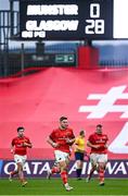 25 March 2023; Jack Crowley of Munster and teammates run into the changing rooms for half-time during the United Rugby Championship match between Munster and Glasgow Warriors at Thomond Park in Limerick. Photo by Harry Murphy/Sportsfile