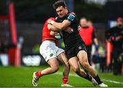25 March 2023; Cole Forbes of Glasgow Warriors is tackled by Paddy Patterson of Munster during the United Rugby Championship match between Munster and Glasgow Warriors at Thomond Park in Limerick. Photo by Harry Murphy/Sportsfile