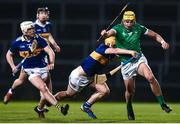 25 March 2023; Cathal O'Neill of Limerick in action against Conor Stakelum of Tipperary as Johnny Ryan of Tipperary looks on during the Allianz Hurling League Division 1 Semi-Final match between Limerick and Tipperary at TUS Gaelic Grounds in Limerick. Photo by John Sheridan/Sportsfile