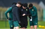 24 March 2023; Andrew Morrissey, STATSports analyst, with players, from left, Mikey Johnston, hidden, Troy Parrott and John Egan during a Republic of Ireland training session at the FAI National Training Centre in Abbotstown, Dublin. Photo by Stephen McCarthy/Sportsfile