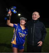 25 March 2023; Emma O'Brien of Presentation Secondary School Milltown celebrates with her grandad Pat Fleming after the Lidl LGFA Post Primary Junior C Final match between Dunmore Community School, Galway, and Presentation Secondary School Milltown, Kerry at Fethard Town Park in Tipperary. Photo by Michael P Ryan/Sportsfile