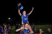 25 March 2023; Presentation Secondary School Milltown players Emma O'Brien, top, and Aideen O'Brien celebrate with the trophy after the Lidl LGFA Post Primary Junior C Final match between Dunmore Community School, Galway, and Presentation Secondary School Milltown, Kerry at Fethard Town Park in Tipperary. Photo by Michael P Ryan/Sportsfile