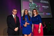 25 March 2023; Laura Glynn of Sarsfields, Galway is presented with her 2021/22 Team of the Year award by Uachtarán an Cumann Camógaíochta Hilda Breslin, right, and Chief Marketing Officer of AIB, Mark Doyle during the AIB Camogie Club Player Awards 2023 at Croke Park in Dublin. Photo by David Fitzgerald/Sportsfile