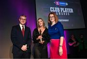 25 March 2023; Aoife Dunne of Oulart The Ballagh, Wexford is presented with her 2021/22 Team of the Year award by Uachtarán an Cumann Camógaíochta Hilda Breslin, right, and Chief Marketing Officer of AIB, Mark Doyle during the AIB Camogie Club Player Awards 2023 at Croke Park in Dublin. Photo by David Fitzgerald/Sportsfile