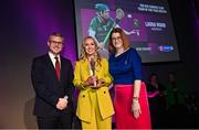 25 March 2023; Laura Ward of Sarsfields, Galway is presented with her 2021/22 Team of the Year award by Uachtarán an Cumann Camógaíochta Hilda Breslin, right, and Chief Marketing Officer of AIB, Mark Doyle during the AIB Camogie Club Player Awards 2023 at Croke Park in Dublin. Photo by David Fitzgerald/Sportsfile