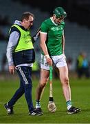 25 March 2023; William O'Donoghue of Limerick leaves the pitch after alongside Limerick team doctor James Ryan, after he was substituted due to injury, during the Allianz Hurling League Division 1 Semi-Final match between Limerick and Tipperary at TUS Gaelic Grounds in Limerick. Photo by Piaras Ó Mídheach/Sportsfile