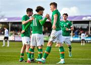 25 March 2023; Kevin Zefi of Republic of Ireland, 11, celebrates with team-mates from left, James McManus, Mark O'Mahony and Rocco Vata after scoring his side's first goal, a penalty, during the UEFA European Under-19 Championship Elite Round match between Republic of Ireland and Estonia at Ferrycarrig Park in Wexford. Photo by Sam Barnes/Sportsfile