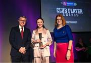 25 March 2023; Amy Boyle of Loughgiel Shamrocks, Antrim is presented with her 2022/23 Team of the Year award by Uachtarán an Cumann Camógaíochta Hilda Breslin, right, and Chief Marketing Officer of AIB, Mark Doyle during the AIB Camogie Club Player Awards 2023 at Croke Park in Dublin. Photo by David Fitzgerald/Sportsfile