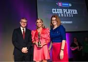 25 March 2023; Caitrin Dobbin of Loughgiel Shamrocks, Antrim is presented with her 2022/23 Team of the Year award by Uachtarán an Cumann Camógaíochta Hilda Breslin, right, and Chief Marketing Officer of AIB, Mark Doyle during the AIB Camogie Club Player Awards 2023 at Croke Park in Dublin. Photo by David Fitzgerald/Sportsfile