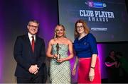 25 March 2023; Róisín McCormick of Loughgiel Shamrocks, Antrim is presented with her 2022/23 Team of the Year award by Uachtarán an Cumann Camógaíochta Hilda Breslin, right, and Chief Marketing Officer of AIB, Mark Doyle during the AIB Camogie Club Player Awards 2023 at Croke Park in Dublin. Photo by David Fitzgerald/Sportsfile