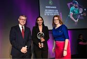 25 March 2023; Niamh McGrath of Sarsfields, Galway is presented with her 2022/23 Connacht Provincial Player of the Year award by Uachtarán an Cumann Camógaíochta Hilda Breslin, right, and Chief Marketing Officer of AIB, Mark Doyle during the AIB Camogie Club Player Awards 2023 at Croke Park in Dublin. Photo by David Fitzgerald/Sportsfile