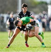 26 March 2023; Mark Diffley of Leitrim in action against Patrick O'Connor of Sligo during the Allianz Football League Division 4 match between Leitrim and Sligo at Avant Money Páirc Seán Mac Diarmada in Carrick-on-Shannon, Leitrim. Photo by Stephen Marken/Sportsfile