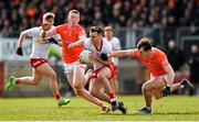 26 March 2023; Darragh Canavan of Tyrone in action against Ciaran Mackin, left, and Barry McCambridge of Armagh during the Allianz Football League Division 1 match between Tyrone and Armagh at O'Neill's Healy Park in Omagh, Tyrone. Photo by Ramsey Cardy/Sportsfile