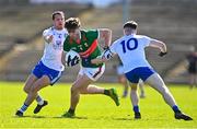 26 March 2023; Sam Callinan of Mayo is tackled by Ryan Wylie, left, and Stephen O'Hanlon of Monaghan during the Allianz Football League Division 1 match between Mayo and Monaghan at Hastings Insurance MacHale Park in Castlebar, Mayo. Photo by Ben McShane/Sportsfile