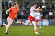26 March 2023; Matthew Donnelly of Tyrone in action against Conor Turbitt of Armagh during the Allianz Football League Division 1 match between Tyrone and Armagh at O'Neill's Healy Park in Omagh, Tyrone. Photo by Ramsey Cardy/Sportsfile
