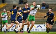 26 March 2023; Hugh McFadden of Donegal in action against, Roscommon players, from left, David Murray, Ruaidhrí Fallon, Enda Smith and Brian Stack during the Allianz Football League Division 1 match between Roscommon and Donegal at Dr Hyde Park in Roscommon. Photo by Sam Barnes/Sportsfile