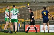 26 March 2023; Referee Joe McQuillan shows a yellow card to Hugh McFadden of Donegal, far  left, during the Allianz Football League Division 1 match between Roscommon and Donegal at Dr Hyde Park in Roscommon. Photo by Sam Barnes/Sportsfile