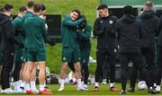 26 March 2023; Robbie Brady is welcomed into the squad by team-mates, including Michael Obafemi, right, during a Republic of Ireland training session at the FAI National Training Centre in Abbotstown, Dublin. Photo by Stephen McCarthy/Sportsfile
