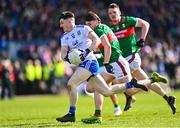 26 March 2023; Stephen O'Hanlon of Monaghan in action against Sam Callinan of Mayo during the Allianz Football League Division 1 match between Mayo and Monaghan at Hastings Insurance MacHale Park in Castlebar, Mayo. Photo by Ben McShane/Sportsfile
