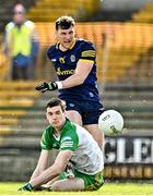 26 March 2023; Diarmuid Murtagh of Roscommon has his shot blocked by Caolan Ward of Donegal during the Allianz Football League Division 1 match between Roscommon and Donegal at Dr Hyde Park in Roscommon. Photo by Sam Barnes/Sportsfile