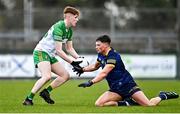 26 March 2023; Johnny McGroddy of Donegal  in action against Conor Cox of Roscommon during the Allianz Football League Division 1 match between Roscommon and Donegal at Dr Hyde Park in Roscommon. Photo by Sam Barnes/Sportsfile