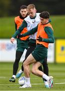 26 March 2023; Mark Sykes is tackled by Robbie Brady, right, during a Republic of Ireland training session at the FAI National Training Centre in Abbotstown, Dublin. Photo by Stephen McCarthy/Sportsfile